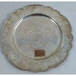 A silver plate, with shaped edge, engraved with coat of arms and motto Virtute et Industria,
