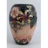 A Moorcroft pottery vase, decorated in the Oberon Honeysuckle pattern, dated circa 1993, height 7.