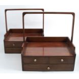 A pair of late Regency mahogany book carriers, of rectangular form, with handle over, the base