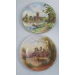 A Royal Worcester plate, decorated with a view of Gloucester Cathedral, together with another