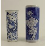 An Oriental cylindrical vase, decorated in blue and white with a dragon and foliage, height 3.