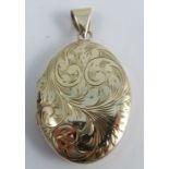 A 9 carat gold oval locket, with engraved decoration, 3.7cm long, 11g gross