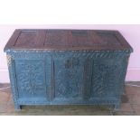 An Antique oak coffer, with four carved panels to the rising lid, three carved panels to the front