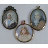 A circular framed portrait miniature, of a young girl with blonde hair, monogramed and dated,