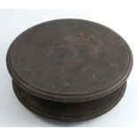 A metal circular turn table, on a circular base with feet, diameter 12.5ins, height 4.5ins