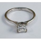A diamond single stone platinum ring, the princess cut stone of approximately 0.45 carats, finger