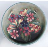 A Moorcroft pottery bowl, decorated in the Spring Flowers pattern, diameter 12.25insCondition