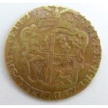 A George III gold half guinea, dated 1777, wight 3.9g
