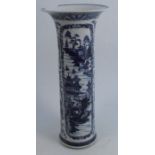 An 19th century Chinese style vase, of cylindrical form with flared rim, decorated in blue and white