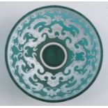 A cameo glass bowl, the green ground with carved white overlay, decorated with scrolls, diameter 3.