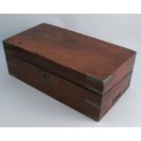 A Victorian mahogany writing box, with brass bands to the corners, the interior having a writing