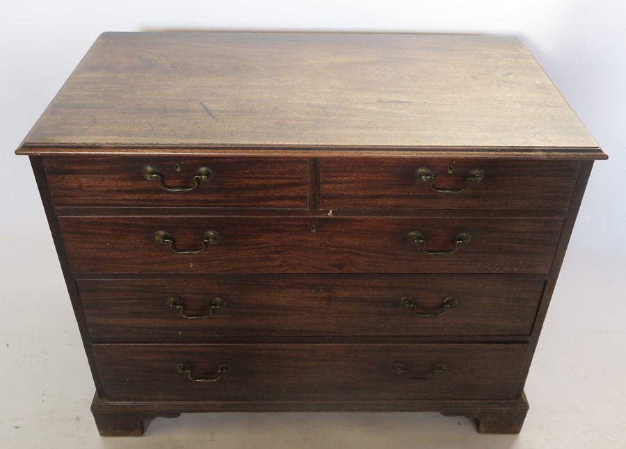 A 19th century mahogany chest, of two short over three long graduated drawers, raised on bracket - Image 2 of 3