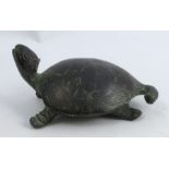An Eastern metal model, of a turtle, with marks to underside, length 3.5ins