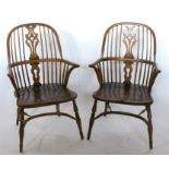 A pair of Windsor armchairs, with pierced splat back, on turned legs united by a crinoline