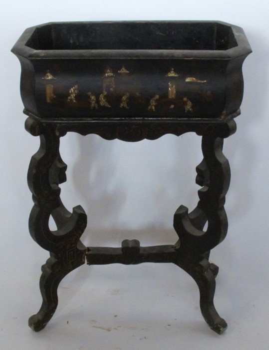 A 19th century papier mache plant stand, the rectangular trough decorated with Oriental figures, the