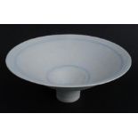 Lucie Rie, a white porcelain footed bowl, decorated with blue lines, impressed mark, height