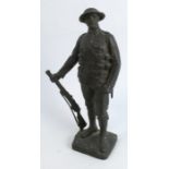 John Tweed, bronze model of a solider standing with his rifle, signed to base J Tweed May 1922,