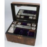 A 19th century walnut travelling box, the interior fitted with a mirror to the lid and with