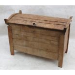 A continental late 19th century beech grain or marriage chest, with slightly domed rising lid and