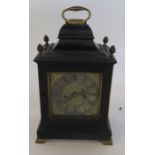 An early 19th century bracket clock, having a square silvered and brass dial, with heavily