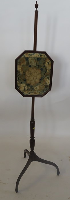 A 19th century mahogany pole screen, the octagonal screen with embroidered floral panel, on a