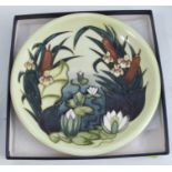 A Moorcroft pottery wall plate, decorated in the Lamia pattern, diameter 10ins, boxedCondition