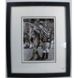 A limited edition framed black and white photograph, of Vinnie Jones and Paul Gascoigne, signed by