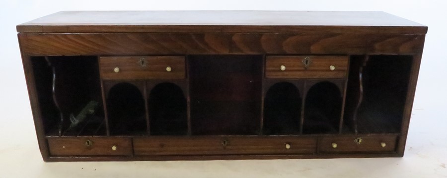 A bank of drawers and pigeon holes, with turned bone knop handles, the hinged top fitted with