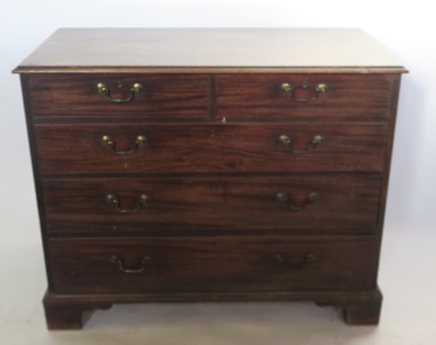 A 19th century mahogany chest, of two short over three long graduated drawers, raised on bracket