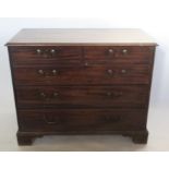 A 19th century mahogany chest, of two short over three long graduated drawers, raised on bracket