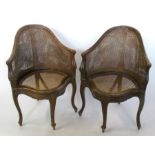 A set of seven bergere dining chairs, with shaped front rail, raised on craved scroll legs