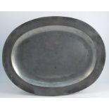An Antique English broad rim pewter oval charger, with touch marks to the reverse, diameter 24ins