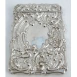 A 19th century silver card case, of shaped rectangular form, with embossed scroll decoration,