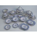 A 19th century child's dinner service, printed in blue and white with birds and foliage,