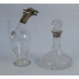 A novelty silver mounted and glass decanter, modelled as a bird, with the hinged lid being the head,