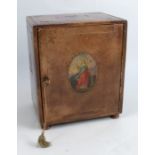 A leather covered table top cabinet, the rectangular door to the front decorated with an oval of a