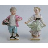A pair of 19th century Meissen porcelain figures, modelled as a boy holding flowers and a girl