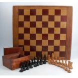A Staunton style wooden chess set, thirty-two pieces, some matched, height of king 3.75ins, in a