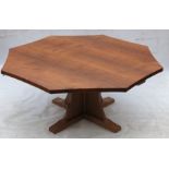 Robert Thompson Mouseman, an oak octagonal dining table, raised on a cross base, with adzed