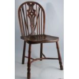 A 19th century yew wood single chair, with a pierced vase splat back flanked by spindles, and having