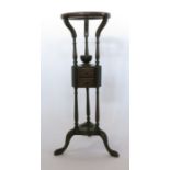 A 19th century mahogany wash stand, the circular top raised on three supports with two small