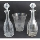 A pair of 19th century glass decanters, the baluster octagonal body etched with grapes and leaves,