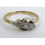 A three stone diamond ring, stamped '18ct Plat', illusion set, finger size N, 2.6g gross