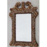 A rectangular wall mirror, the frame set with seashells, overall dimension 38ins x 23ins