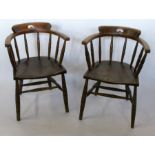 A pair of captain armchairs, with spindle backs, turned legs united by turned stretchers