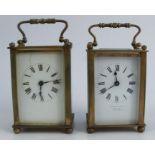 Two carriage clocks, with glass and gilt metal cases, the white enamel dials with Roman numerals,