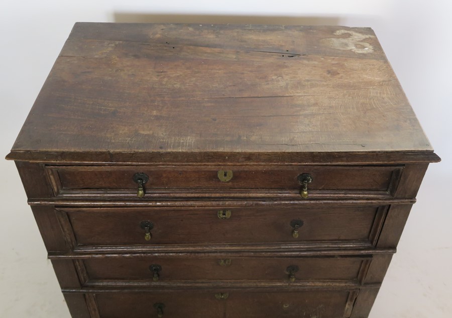 An Antique oak chest, of four long graduated drawers, with moulded fronts, width 36.5ins, height - Image 2 of 4