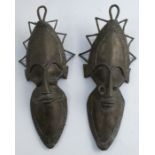 Two metal tribal masks, height 11ins