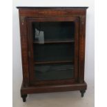 A 19th century walnut pier cabinet, the glazed door revealing shelves, the whole with satinwood l=