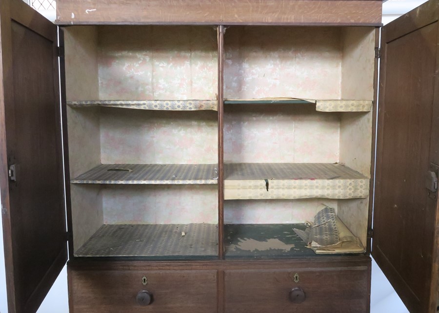 A 19th century oak linen press, the cupboard fitted with shelves, the base with two short over three - Image 3 of 3